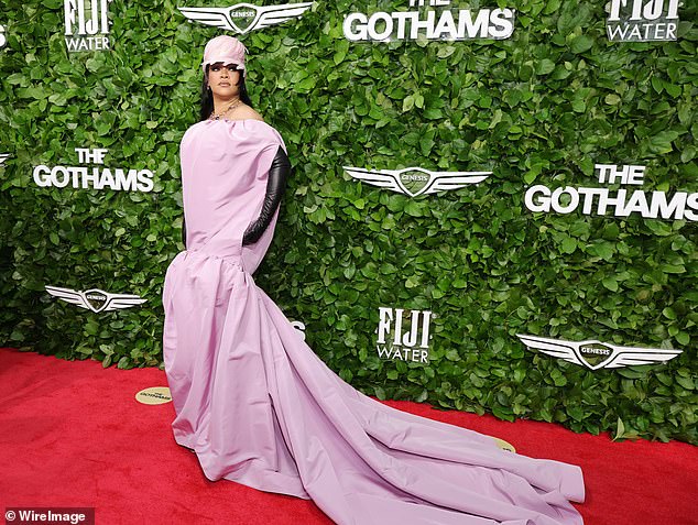 Rihanna, 37, suffered a rare fashion fail as she hit the red carpet in a shapeless pink gown with a baggy bodice and sheet-like train