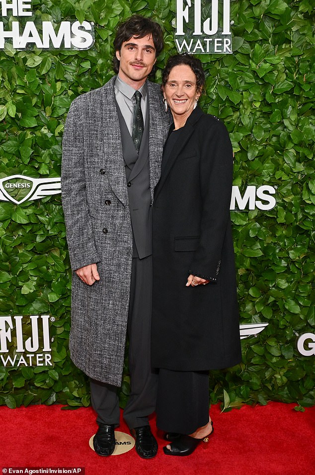 Jacob Elordi, 28, towered over his mother Melissa Elordi while rocking a gray three-piece suit and a tweed coat