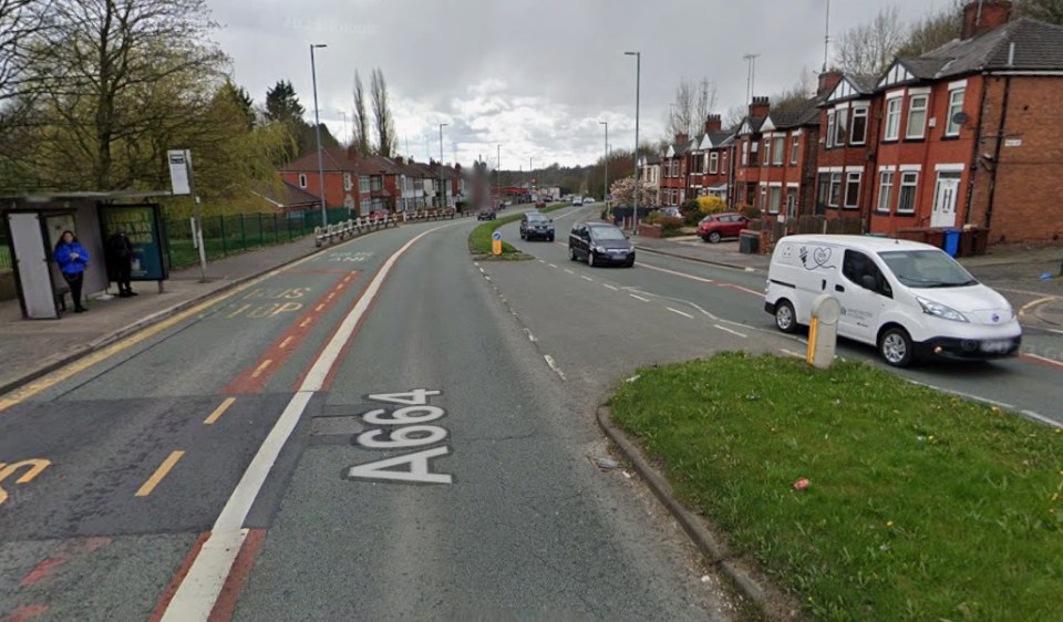 A photo of Rochdale Road and White Moss Road with cars, a bus stop, and houses.