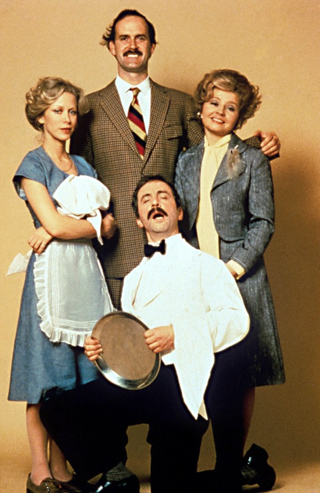 Publicity photo for the television show "Fawlty Towers" showing John Cleese, Prunella Scales, Andrew Sachs, and Connie Booth.