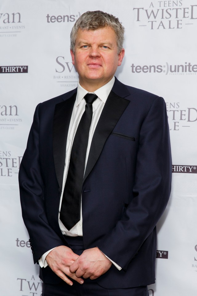 Adrian Chiles in a dark suit and black tie at the Teens Unite Charity Ball.