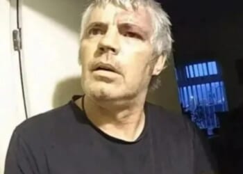 Moment thug calmly asks 'can I put my shoes on?' as he's arrested on his doorstep after murdering pensioner neighbour