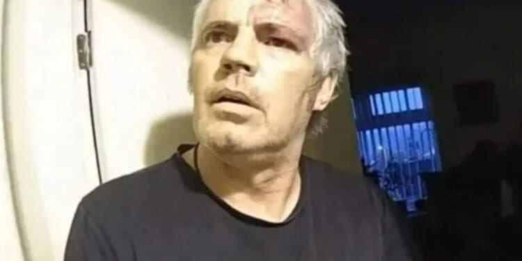 Moment thug calmly asks 'can I put my shoes on?' as he's arrested on his doorstep after murdering pensioner neighbour