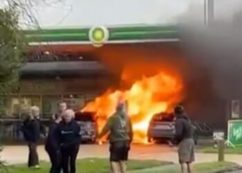 Huge fire erupts at BP petrol station engulfing two vehicles and pump as man seen on forecourt with axe before arrest