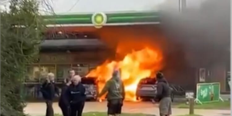 Huge fire erupts at BP petrol station engulfing two vehicles and pump as man seen on forecourt with axe before arrest