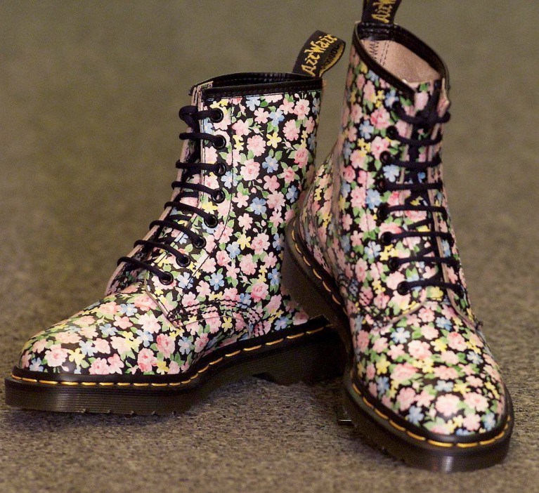 Pair of Dr. Martens boots with a floral pattern.