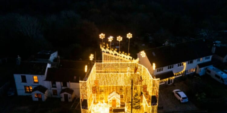 Homeowner’s incredible Christmas lights display brings some serious festive cheer… but would YOU want to live next door?