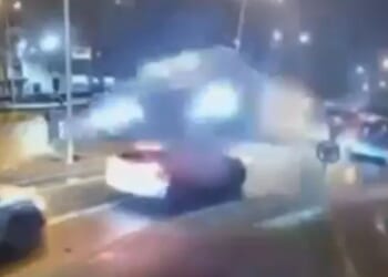 Terrifying moment speeding Mercedes is catapulted into the air and jumps over two cars after hitting roundabout