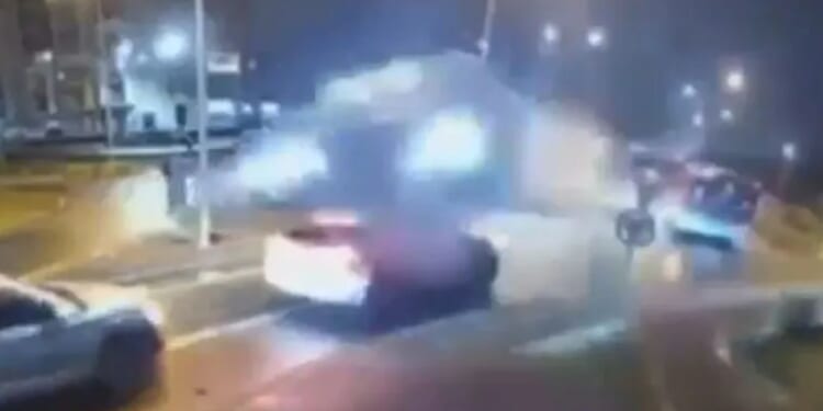 Terrifying moment speeding Mercedes is catapulted into the air and jumps over two cars after hitting roundabout