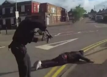 Dramatic moment armed cops swoop on 'cowardly' killer, 39, who stabbed three people as he lies face down in road