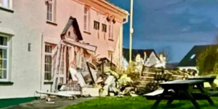 Bulldozer driver flattens car and 'deliberately' smashes into village pub in 'targeted' attack