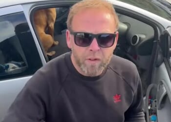 Moment raging driver screams 'your sh**ing all over the village' at horserider and tries to grab phone in furious tirade