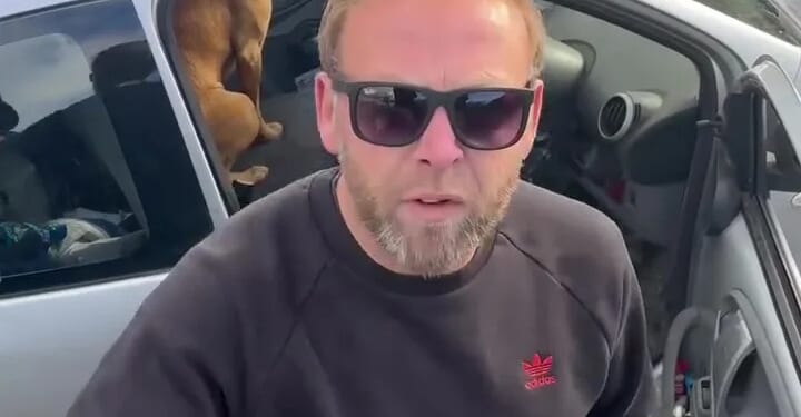 Moment raging driver screams 'your sh**ing all over the village' at horserider and tries to grab phone in furious tirade