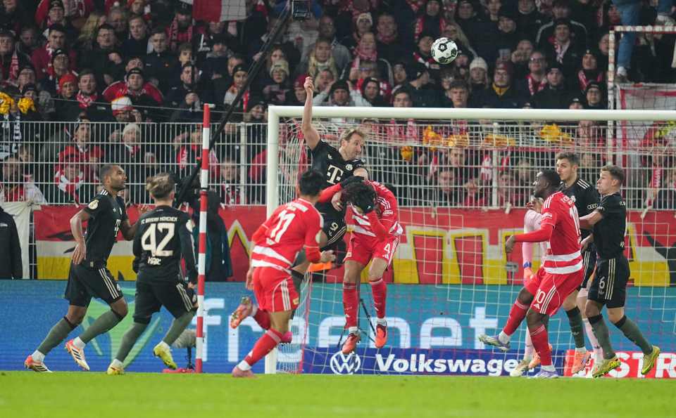 Diogo Leite and Harry Kane battle for the ball during the DFB cup match.