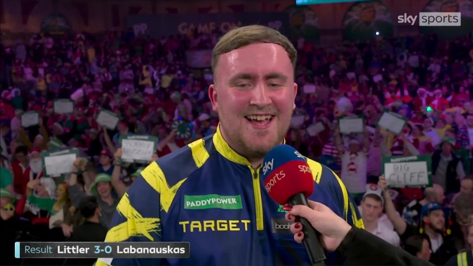 Luke Littler being interviewed after defeating Darius Labanauskas 3-0 in a darts match.