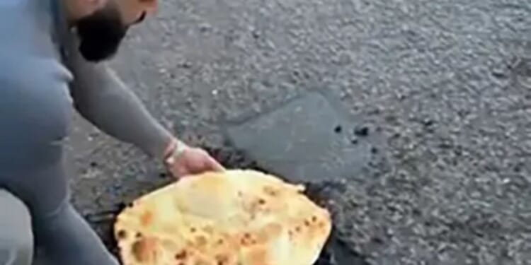 Moment fed-up curry boss plugs gaping pothole with 18-inch mega naan bread to shame council bosses
