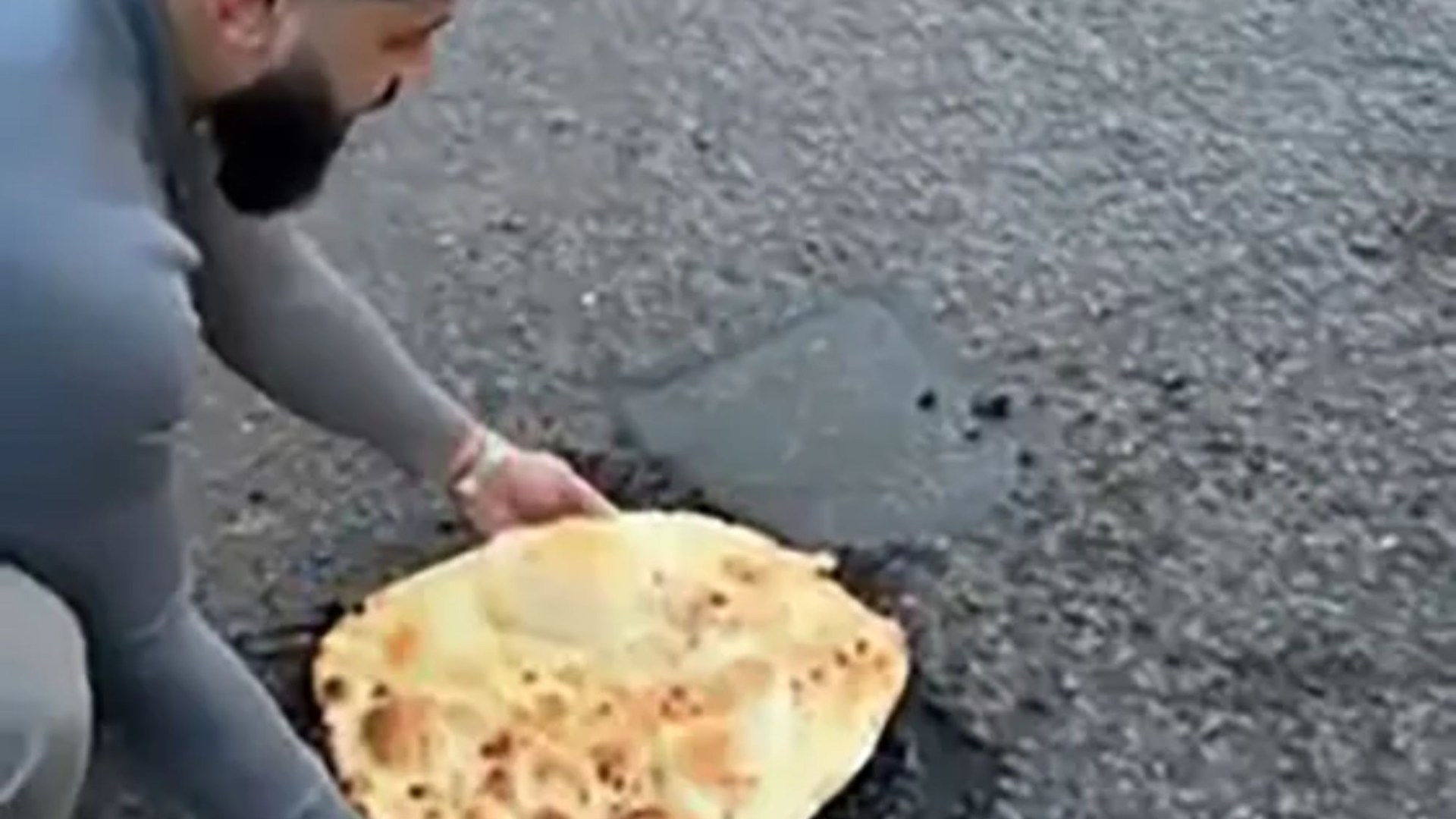 Moment fed-up curry boss plugs gaping pothole with 18-inch mega naan bread to shame council bosses
