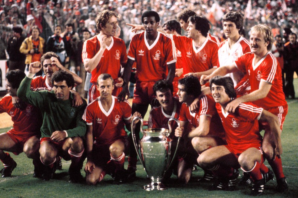 Nottingham Forest players celebrating with the European Cup trophy after defeating Hamburg.