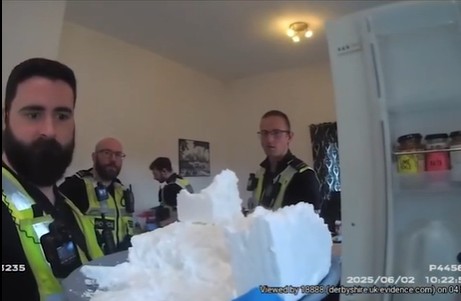 Moment cops find giant plate of cocaine in kitchen fridge after storming house as drug dealer jailed