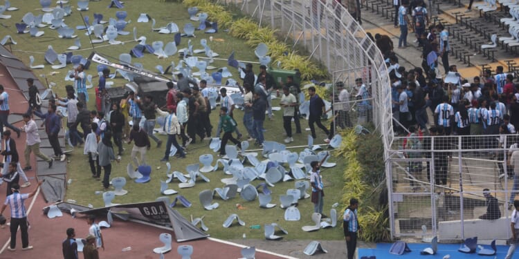 Lionel Messi turns up to unveil 70ft statue of himself in India... but raging fans go wild hurling bottles & chairs