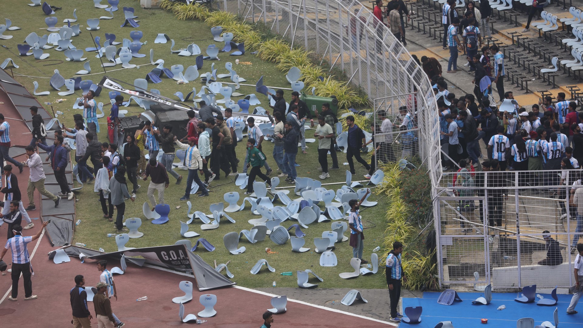 Lionel Messi turns up to unveil 70ft statue of himself in India... but raging fans go wild hurling bottles & chairs