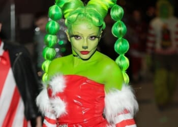 Pop star looks unrecognisable as she transforms into The Grinch for festive birthday bash