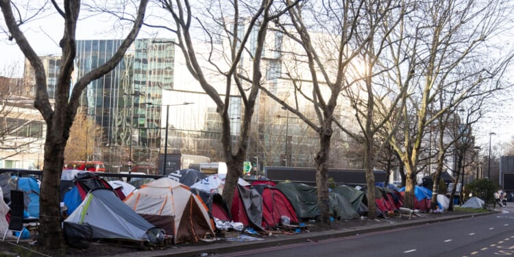 Welcome to UK's 'Skid Row' tent village where 'forgotten' residents fear for their lives in shadow of plush mansions