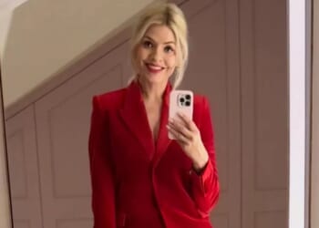Holly Willoughby wears festive red suit for Christmas night out after court action for knocking rider off his scooter