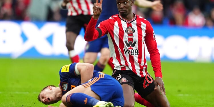 Newcastle star Dan Burn 'rushed to hospital with breathing difficulties' after going off with rib injury at Sunderland