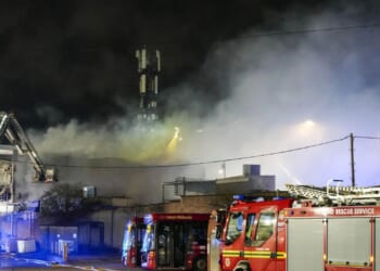 Blaze breaks out at pork scratchings factory as huge flames erupt and 50 firefighters race to scene
