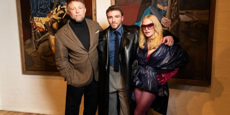 Madonna and Guy Ritchie pictured together for the first time in 17 YEARS as they reunite at son Rocco's art launch