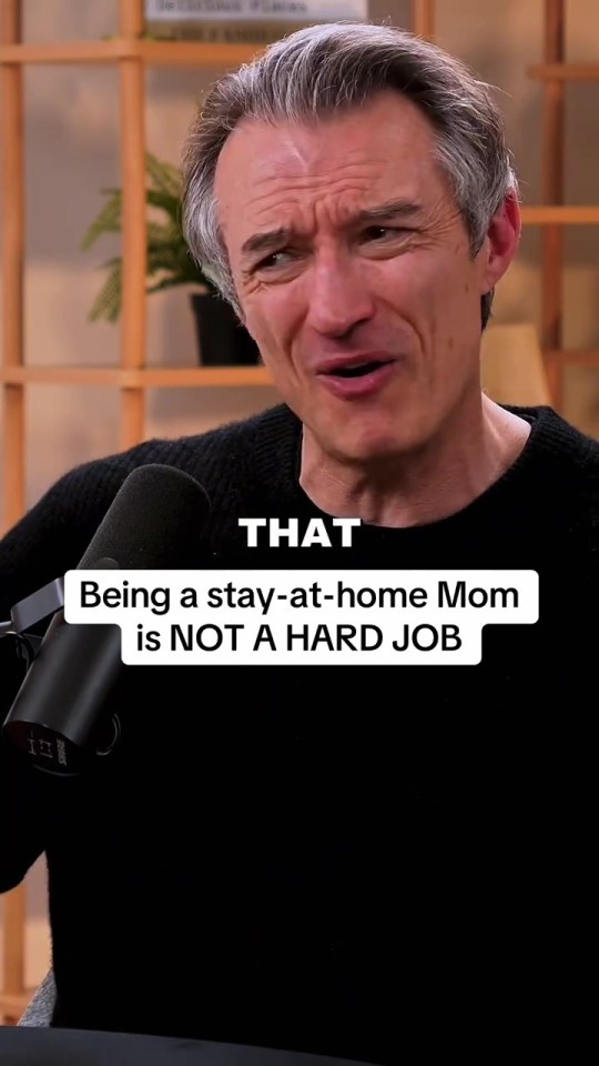 Man speaking into a microphone with text overlay "Being a stay-at-home Mom is NOT A HARD JOB".