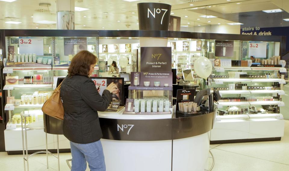 A customer at the counter of Boots during its relaunch No7 Protect & Perfect Intense Beauty Serum, which is available in all Boots stores from today, at the store on Oxford Street, London.