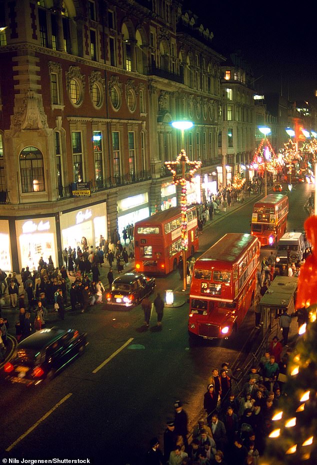 Oxford Street, London's busiest shopping thoroughfare, pictured in December 1988, with shoppers out in their droves - BBC radio and TV legend Sir Terry Wogan switched on the festive lights that year