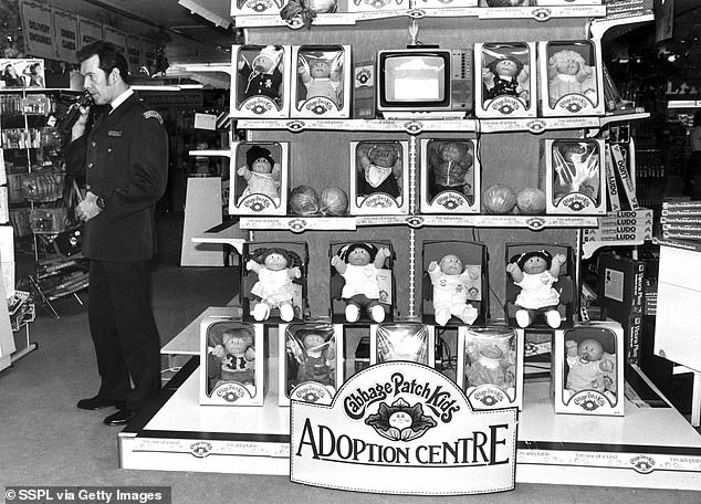 The Cabbage Patch craze, which saw 'adoption centres' set up in UK stores, sparked additional security to prevent pandemonium, after riots were reported in US stores as shoppers fought to buy the dolls (Pictured, a store in Manchester with a Cabbage Patch Adoption Centre)