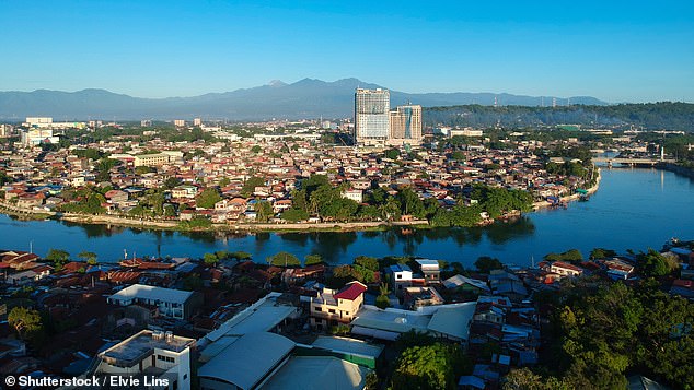 Davao City, pictured, is five hours from the Islamic city of Marawi - where ISIS sympathisers are waging a fight against the Catholic-dominated government