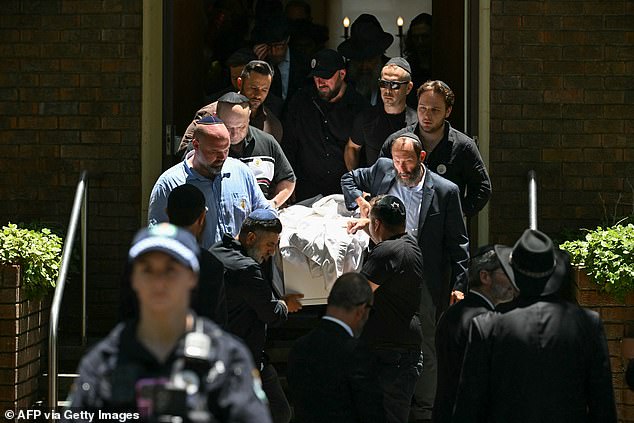 Mourners carry out the coffin of 10-year-old Matilda, who was killed in the December 14 Bondi Beach shooting attack, after the funeral service in Sydney on December 18, 2025. The attack at Bondi Beach on December 14 was one of the deadliest in Australian history. (Photo by Saeed KHAN / AFP via Getty Images)