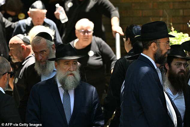 Mourners leave after the funeral service for 10-year-old Matilda, who was killed in the December 14 Bondi Beach shooting attack, in Sydney on December 18, 2025. Australia's Prime Minister Anthony Albanese promised a sweeping crackdown on "hate, division and radicalisation" on December 18 after a mass shooting killed 15 people at a Jewish festival on Bondi Beach. (Photo by Saeed KHAN / AFP via Getty Images)