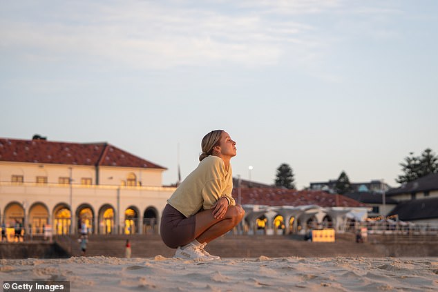 SYDNEY, AUSTRALIA - DECEMBER 18: Mercedes Pereyra visits Bondi Beach during sunrise, on December 18, 2025 in Sydney, Australia. Police say at least 16 people, including one suspected gunman, were killed and more than 40 others injured when two attackers opened fire near a Hanukkah celebration at the world-famous Bondi Beach, in what authorities have declared a terrorist incident. The government is moving to tighten gun laws across the country. (Photo by Audrey Richardson/Getty Images)