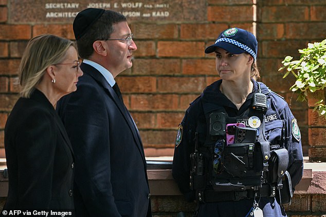 Leader of the opposition Liberal Party Sussan Ley (L) arrives for the funeral of 10-year-old Matilda, who was killed in the December 14 Bondi Beach shooting attack, in Sydney on December 18, 2025. The attack at Bondi Beach on December 14 was one of the deadliest in Australian history. (Photo by Saeed KHAN / AFP via Getty Images)