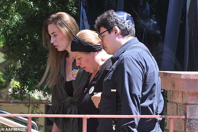 Matilda's mother Valentyna (centre) at her daughter's funeral