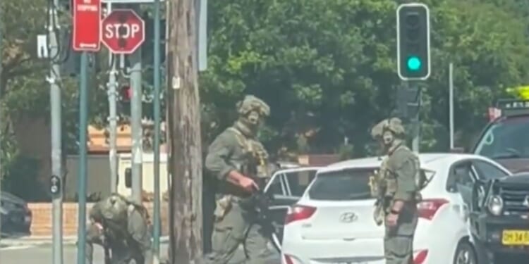 Heavily armed cops ram car in Sydney ‘and arrest five’ with city on edge in wake of Bondi terror attack