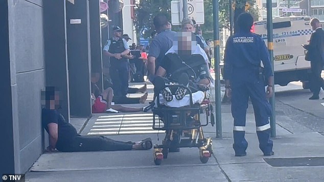 One of the men was taken from the scene in a gurney