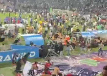 Cup final descends into chaos with pitch invasion and FENCES thrown as hundreds of supporters clash