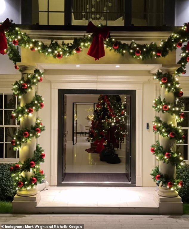 Going for a more theatrical look, Mark Wright and Michelle Keegan wrapped their arches in wreath and adorned with red decorations