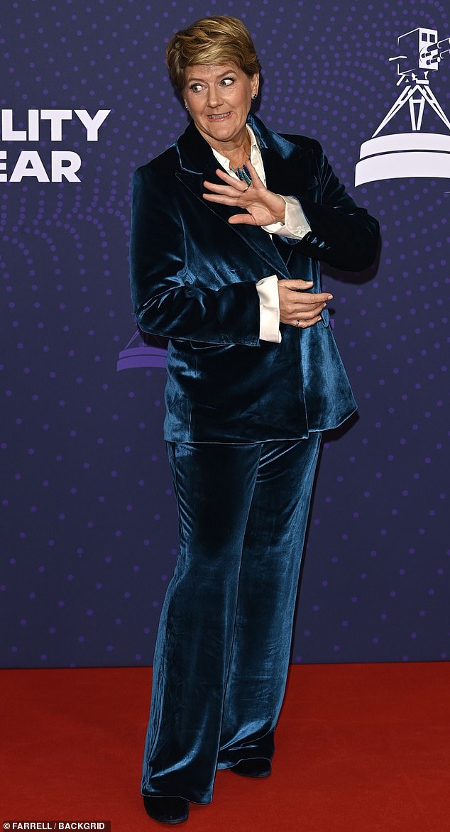 Claire looked stylish in a blue velvet suit as she put on a very animated display