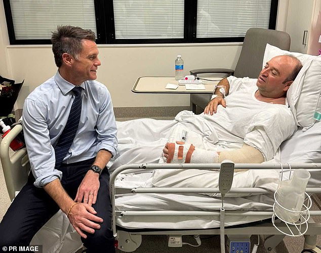 NSW Premier Chris Minns is pictured at Mr Al-Ahmed's bedside earlier this week