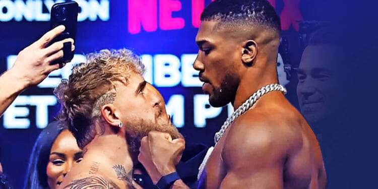 Anthony Joshua makes slitting throat gesture to Jake Paul after almost coming to blows in face off ahead of Netflix bout
