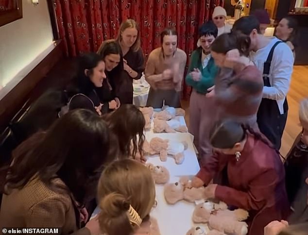 The party was filled with plenty of activities - such as seeing who could put a diaper on a teddy bear the quickest