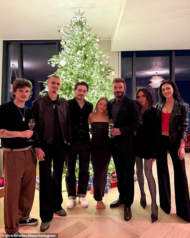 Victoria Beckham - pictured here with her family at Christmas in 2024 - has previously enlisted Jane Means' professional gift wrapping expertise